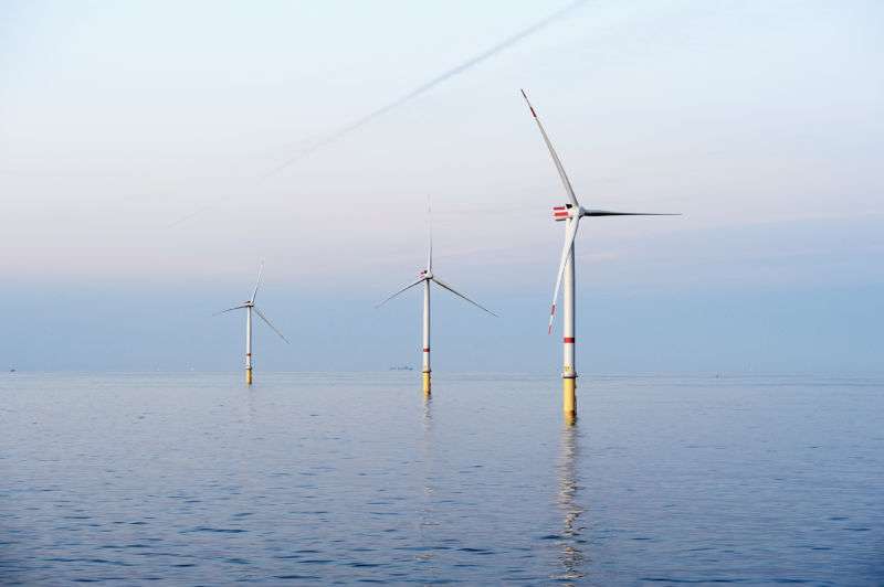 Several offshore wind turbines.